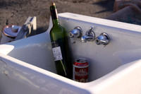 Bottle and Beer in a Sink